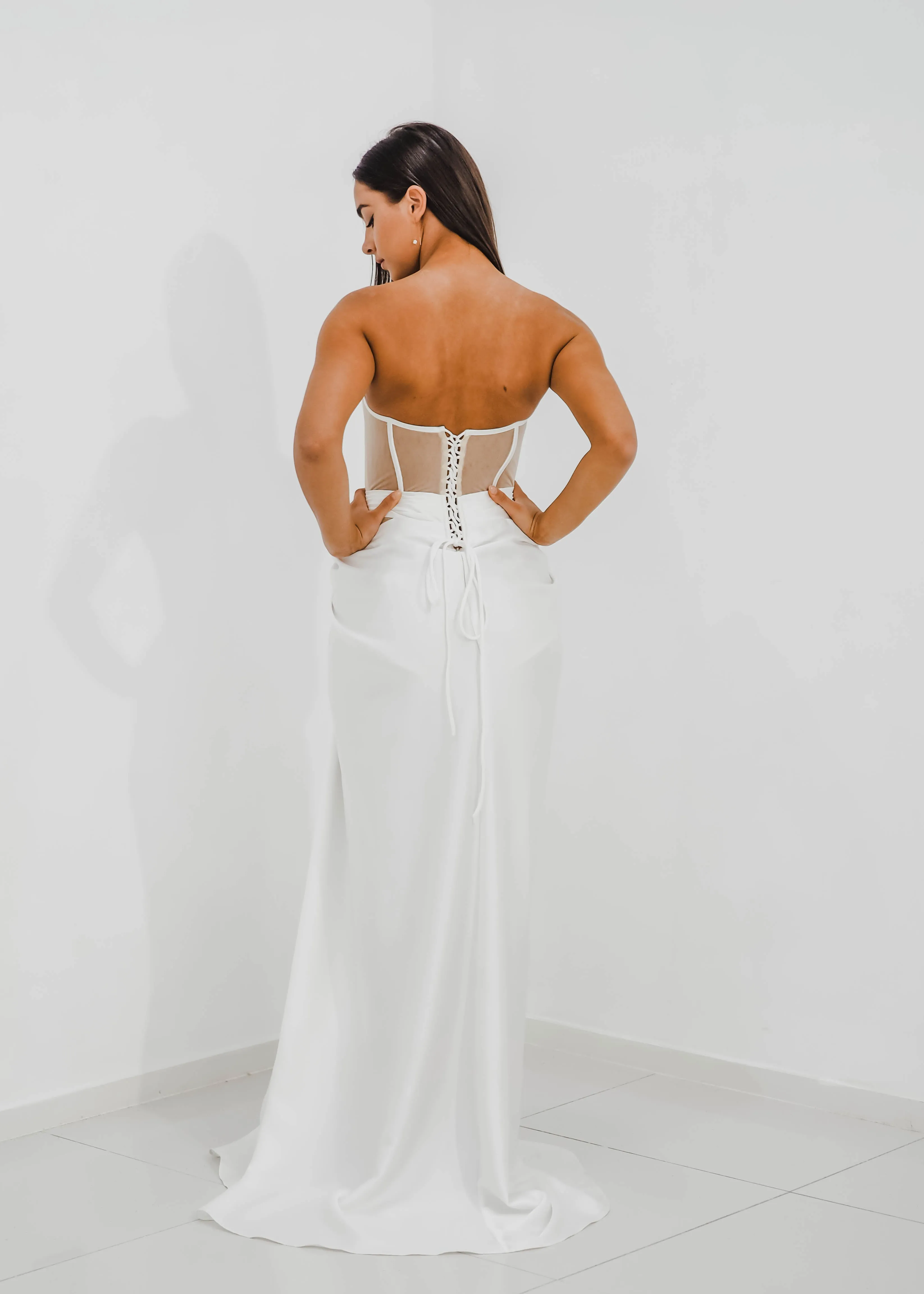 White bustier top with transparent bodice and high slit dress