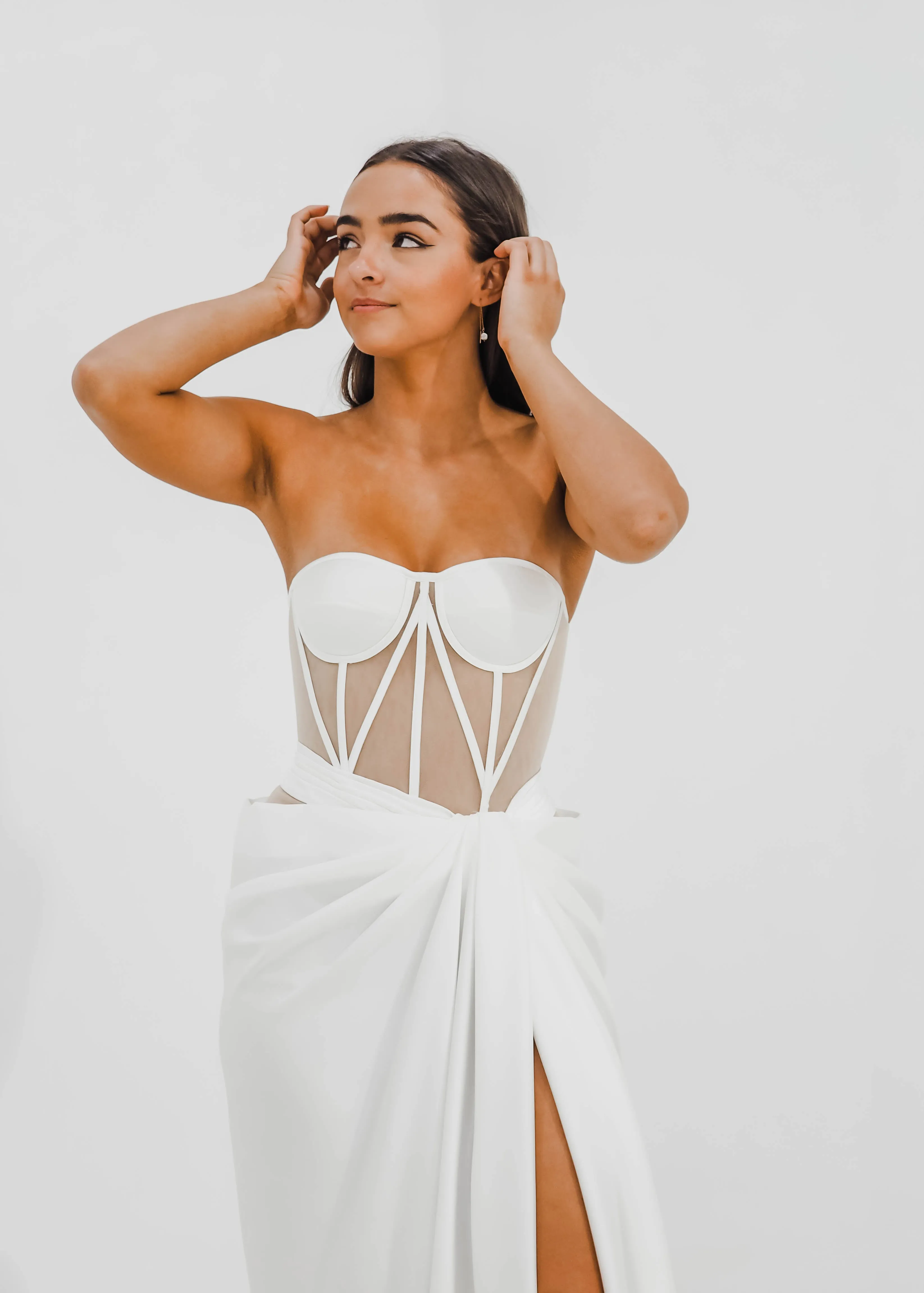 White bustier top with transparent bodice and high slit dress