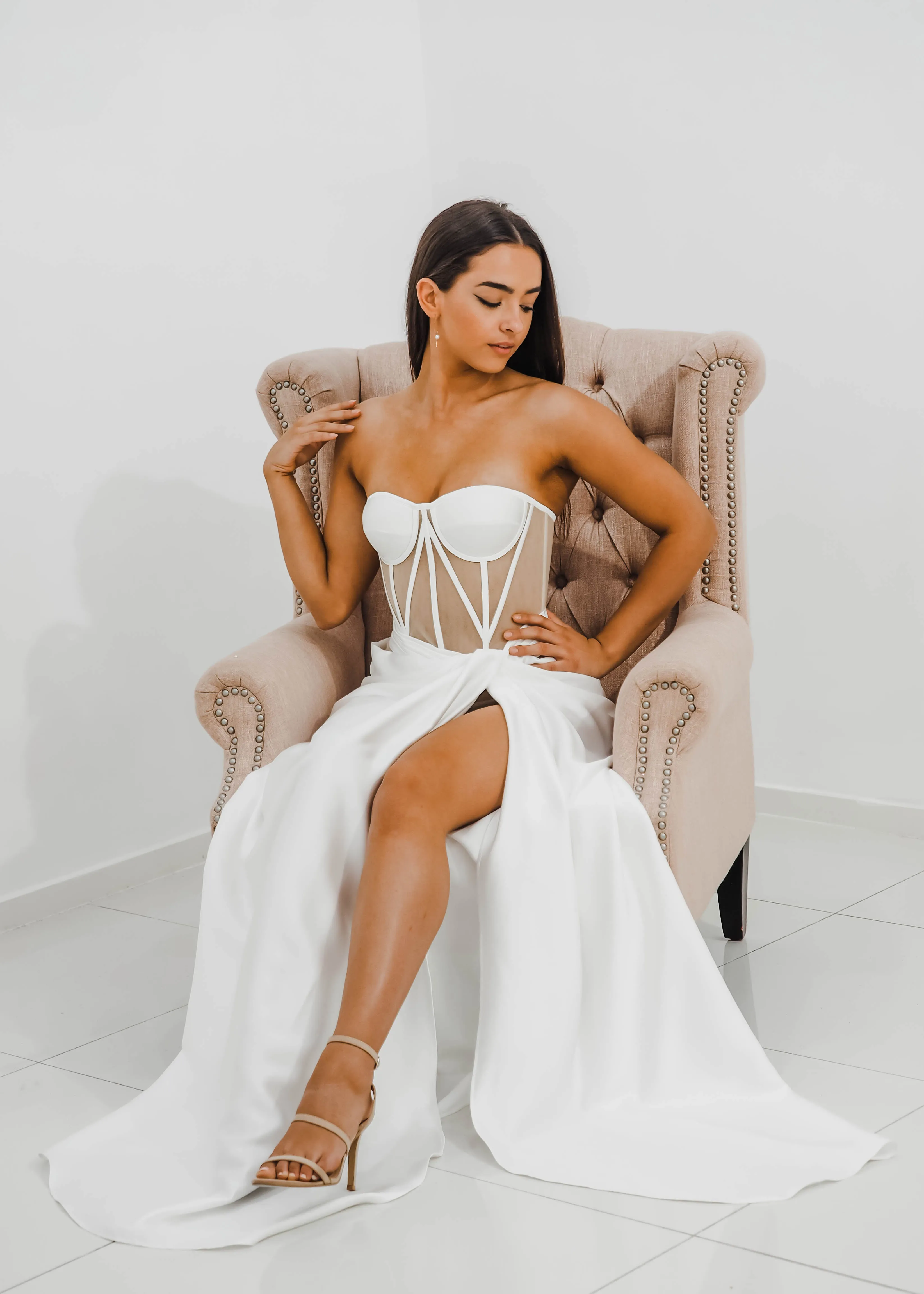 White bustier top with transparent bodice and high slit dress