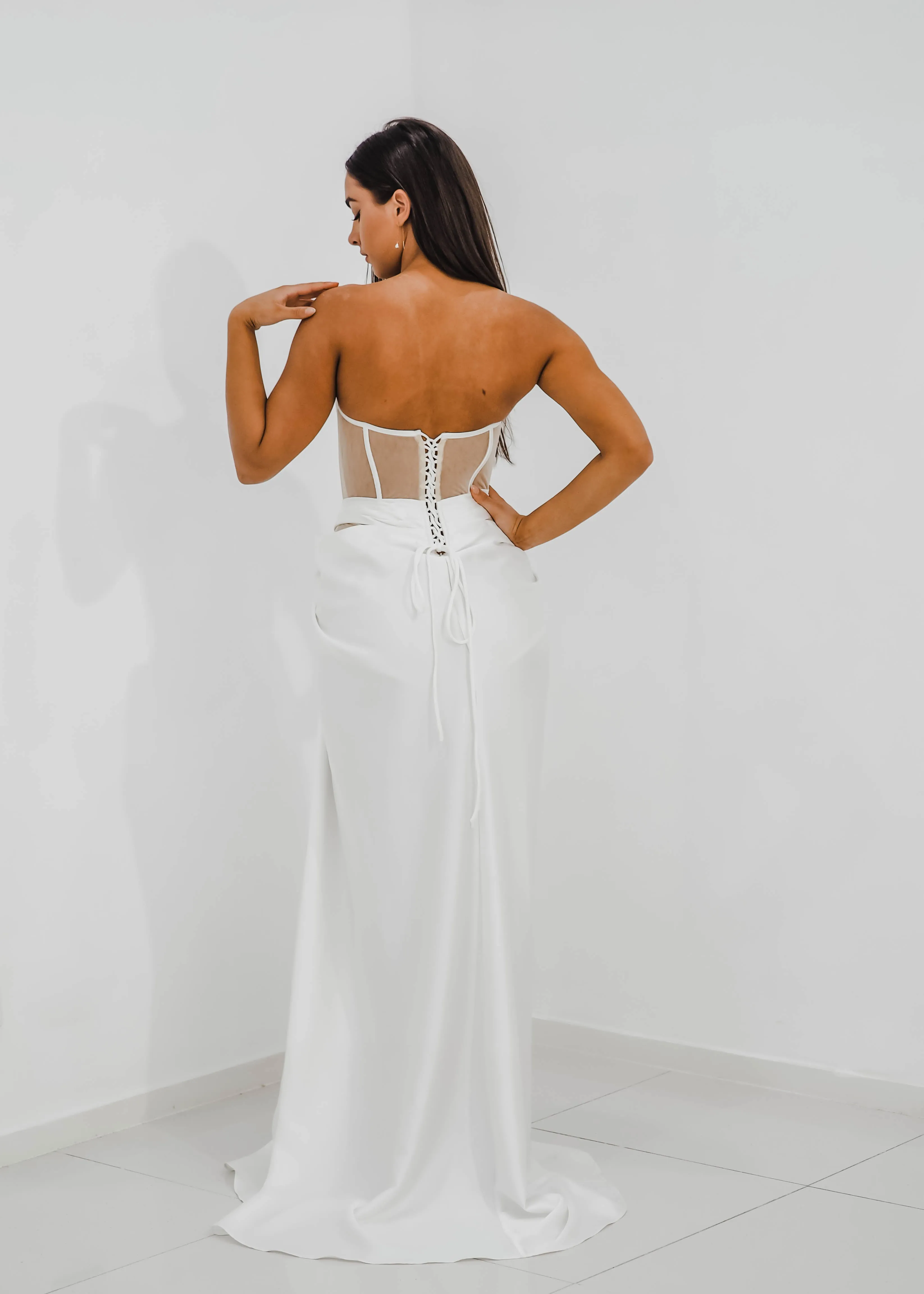 White bustier top with transparent bodice and high slit dress