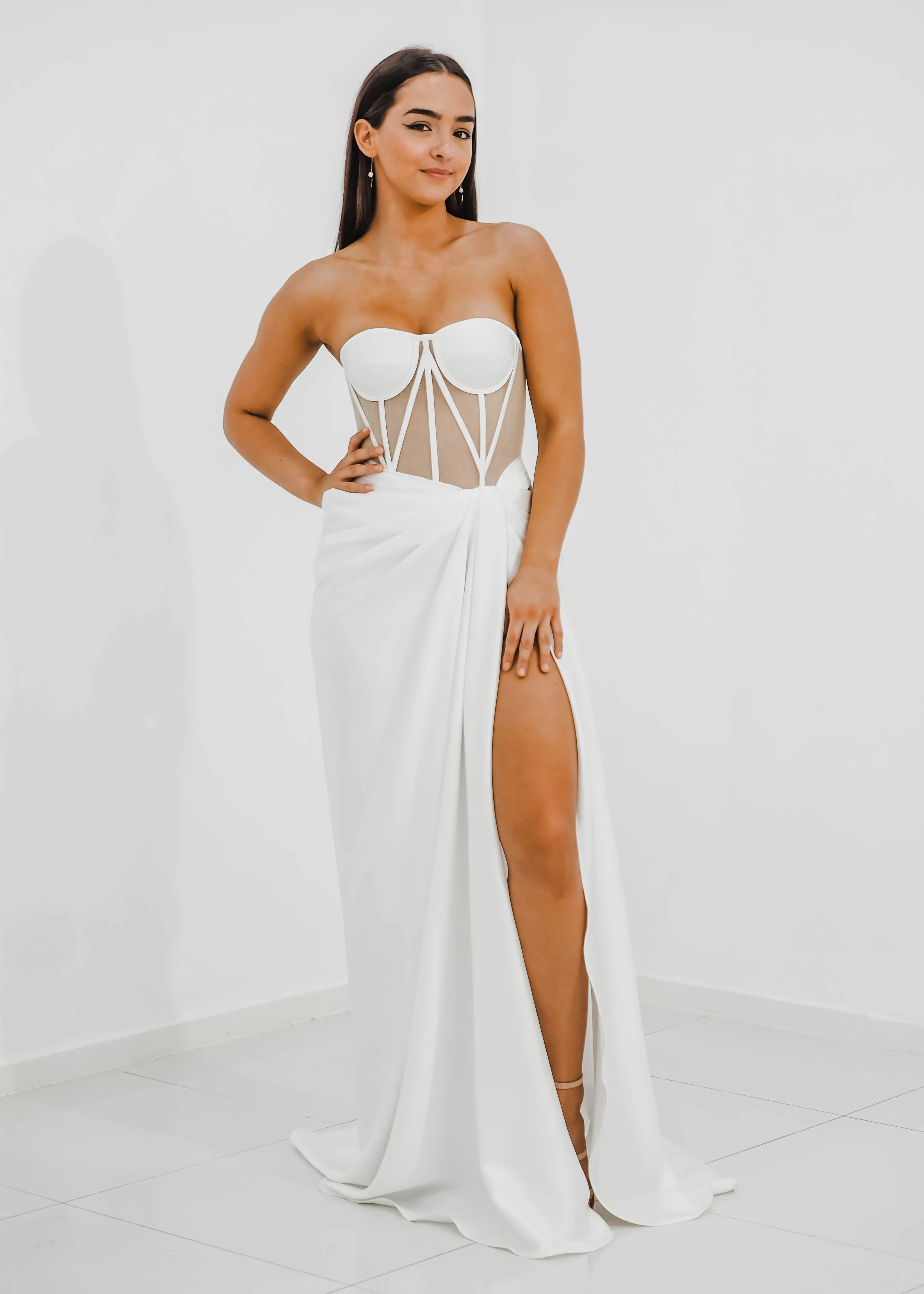 White bustier top with transparent bodice and high slit dress