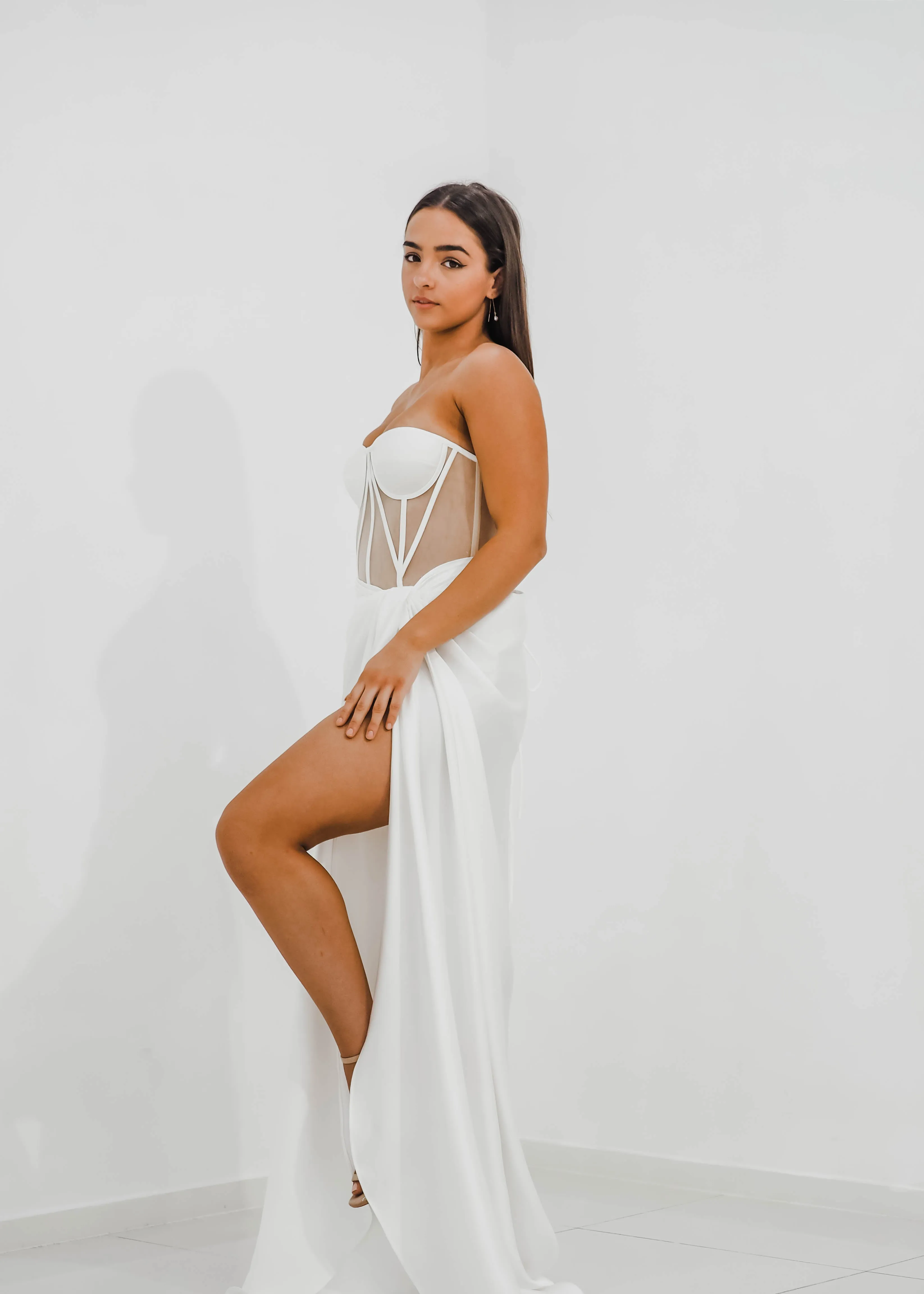 White bustier top with transparent bodice and high slit dress