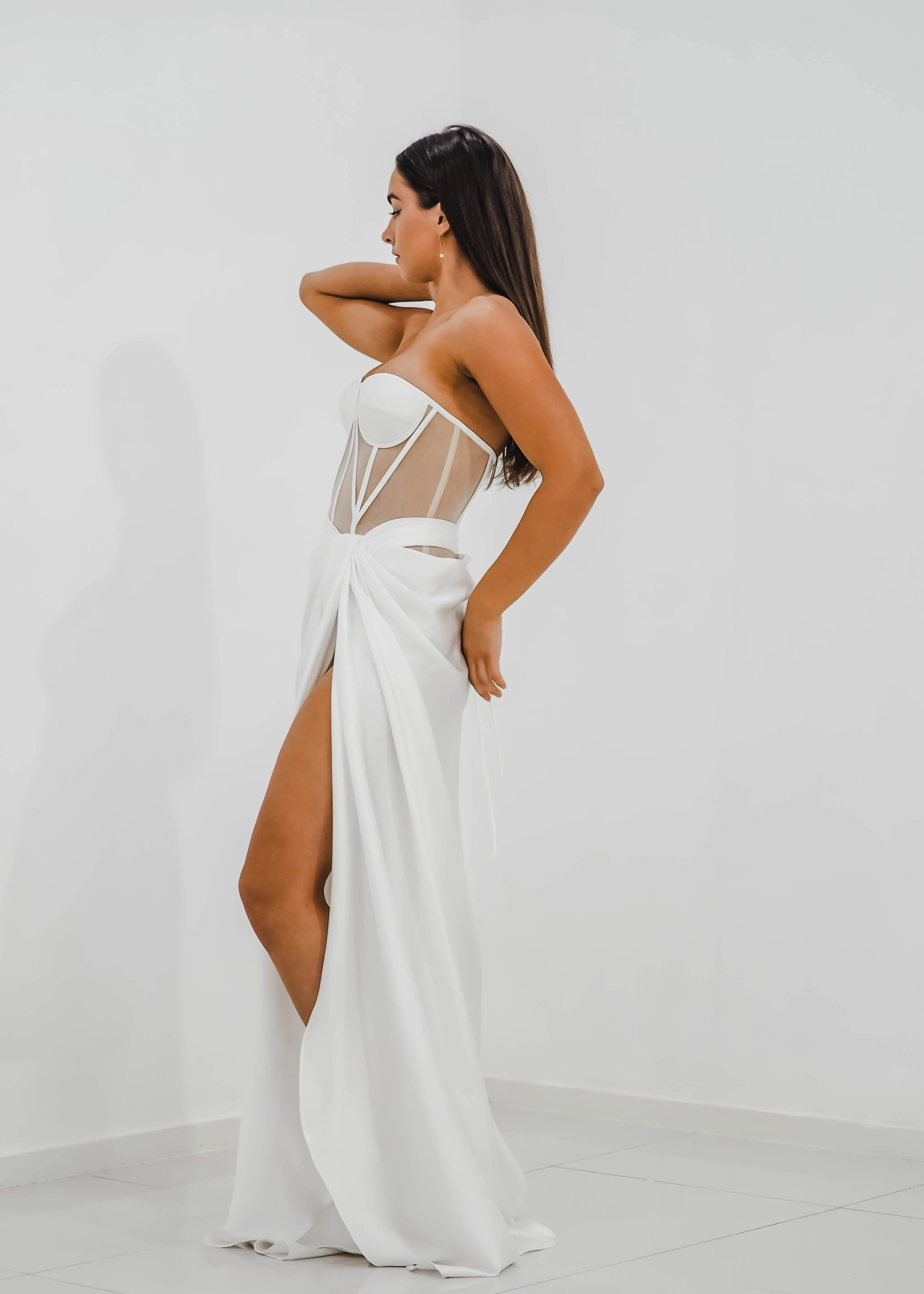 White bustier top with transparent bodice and high slit dress